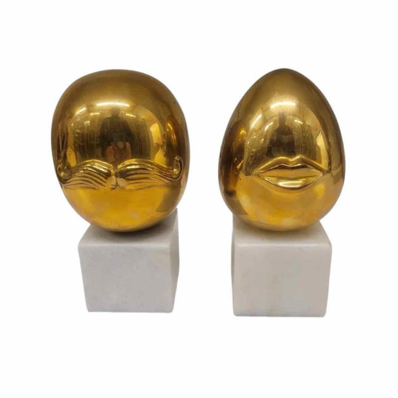 Pair of Mr. & Mrs. Brass Eggs on Marble Bases by Jonathon Adler