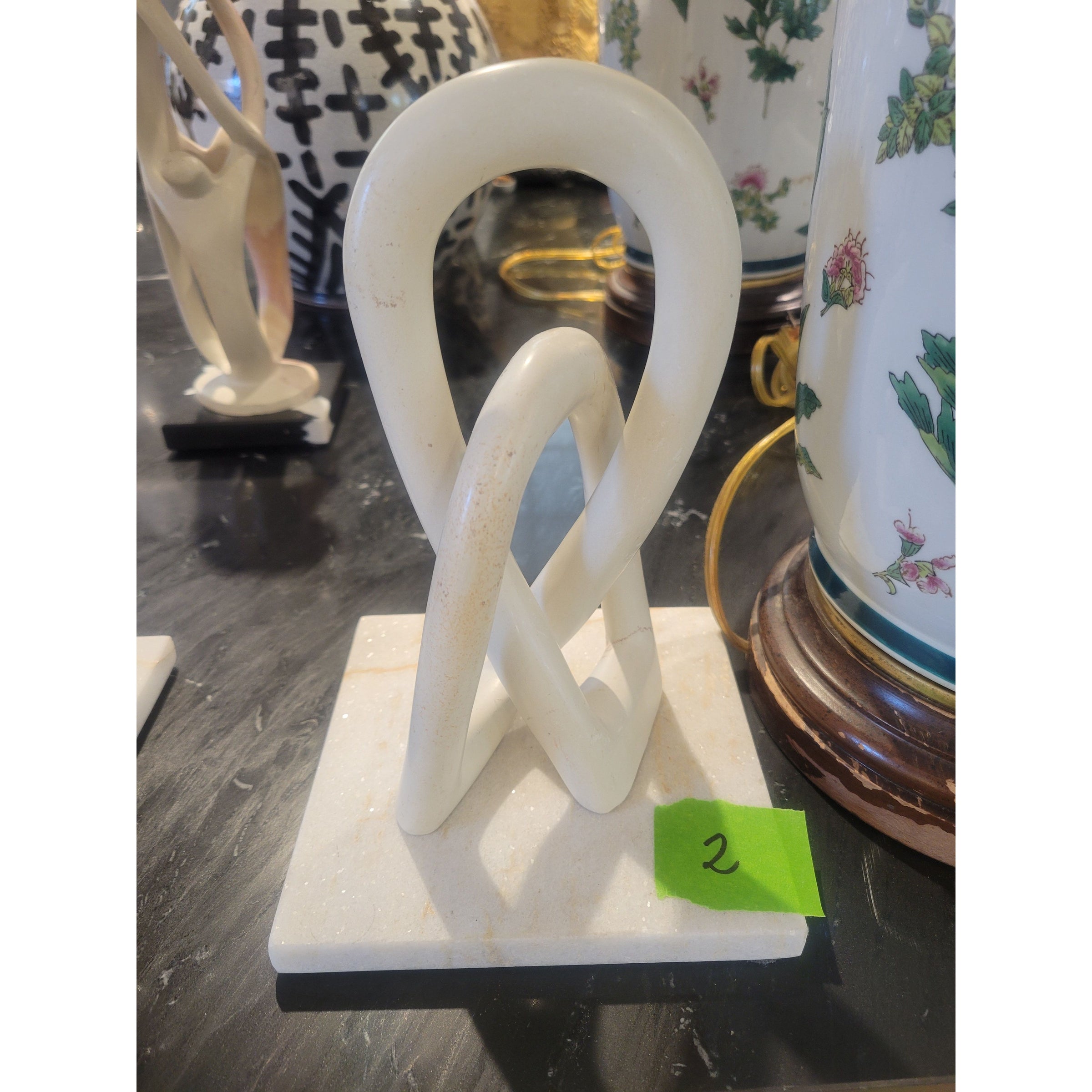 Infinity Loops Sculpture on White Marble Base