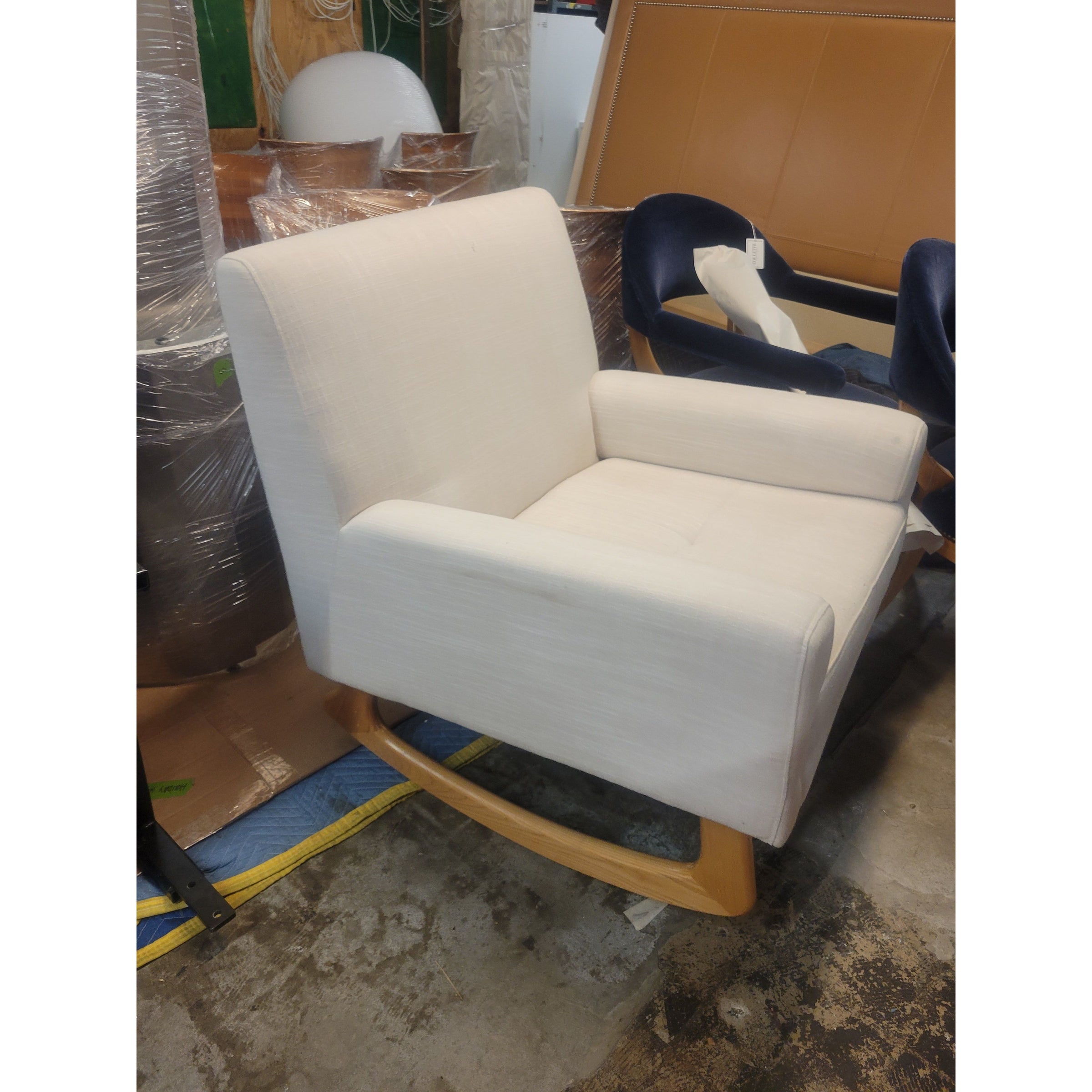 White Upholstered Rocking Chair on Wood Legs