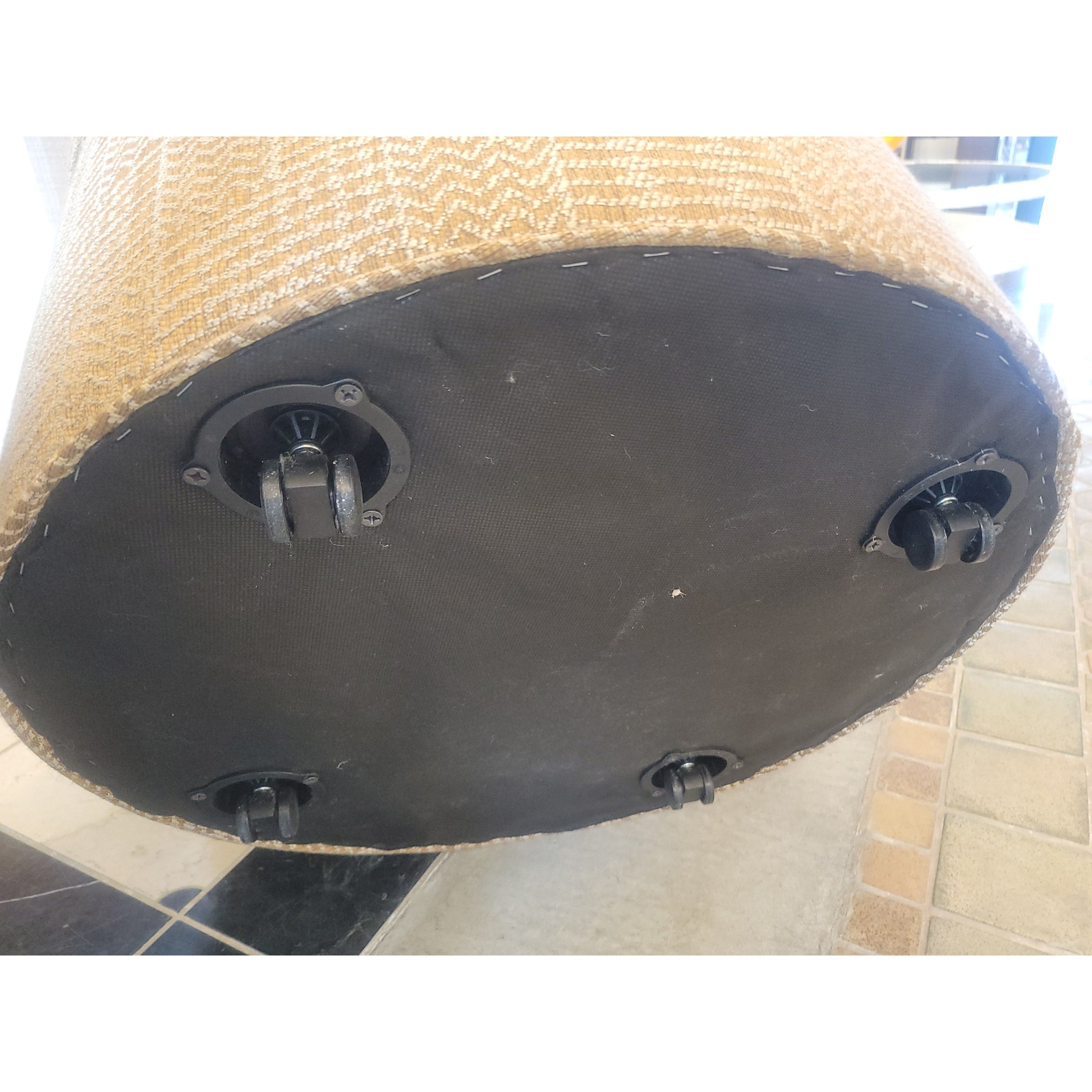 Tan Upholstered Storage Ottoman on Casters