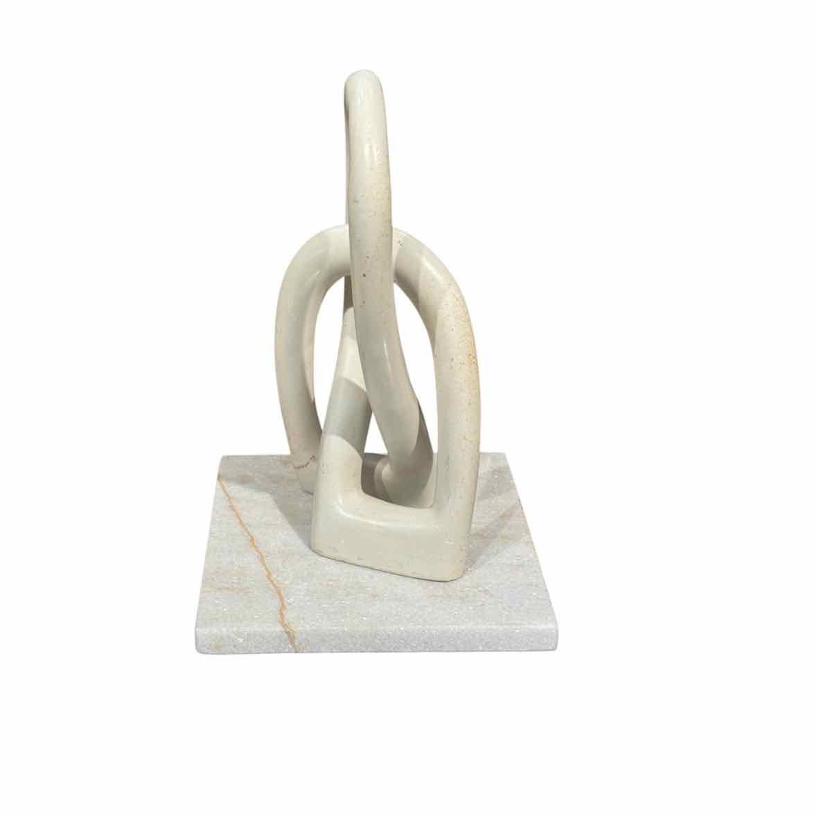 Infinity Loops Sculpture on White Marble Base