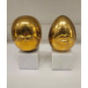 Pair of Mr. & Mrs. Brass Eggs on Marble Bases by Jonathon Adler