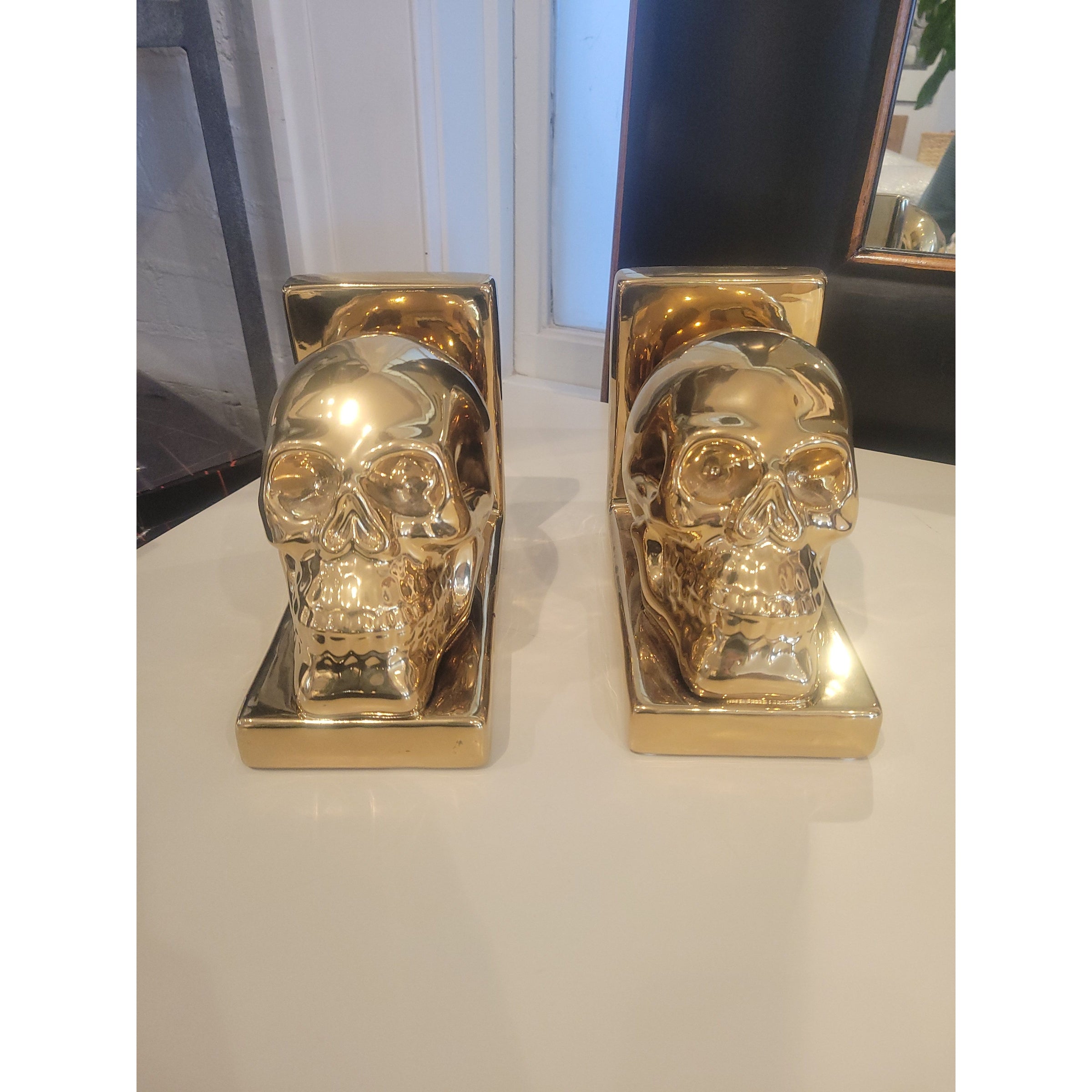 PAIR of Gold Skull Bookends - colletteconsignment.com