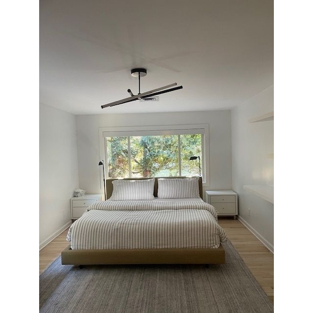 King-Sized Tan Upholstered Bed