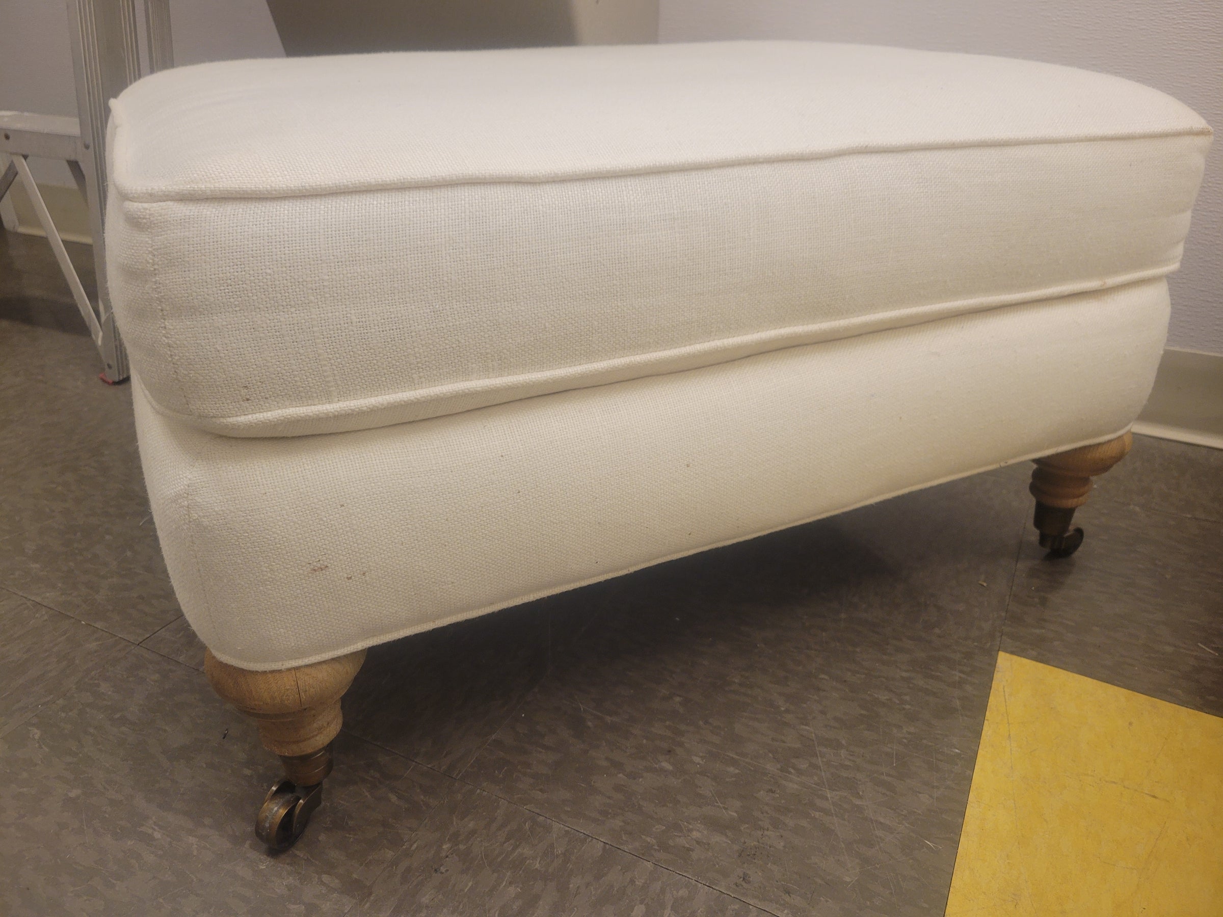 Rectangular Beige Fabric Ottoman w/ Turned Wood Feet on Casters